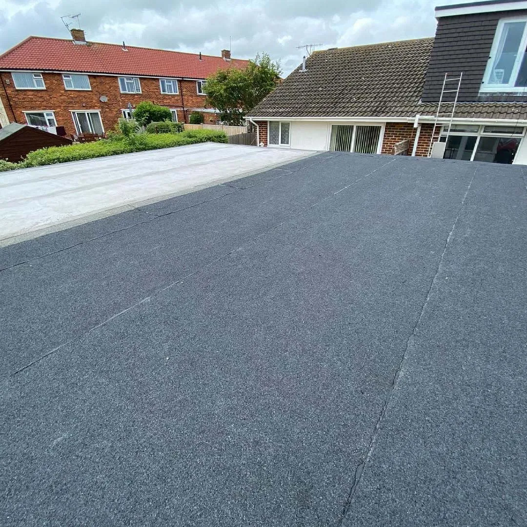 home on quiet road with a flat roof